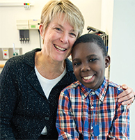 Carlyle Glah, LSW, MSW,who works with patients awaiting kidney transplants and their parents, with kidney transplant patient Samad, 10. Social workers play a pivotal role with Nephrology patients, whether they are experiencing an acute episode or require 