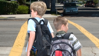 Student walking home from school with backpack