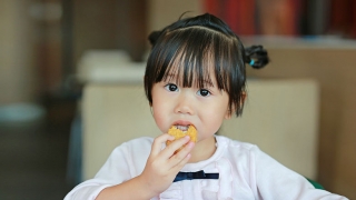 Girl eating chicken nugget