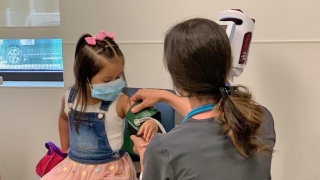 Young girl in doctors office being checked
