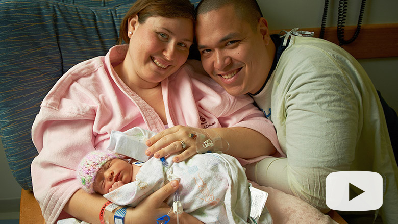 Mom and dad with infant daughter