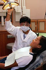 Picture of a young girl during a visit to her dentist