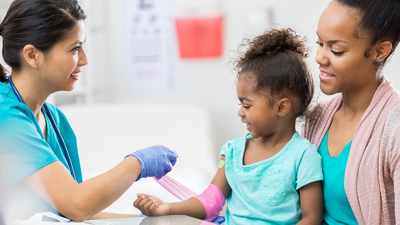 Kid getting her blood drawn