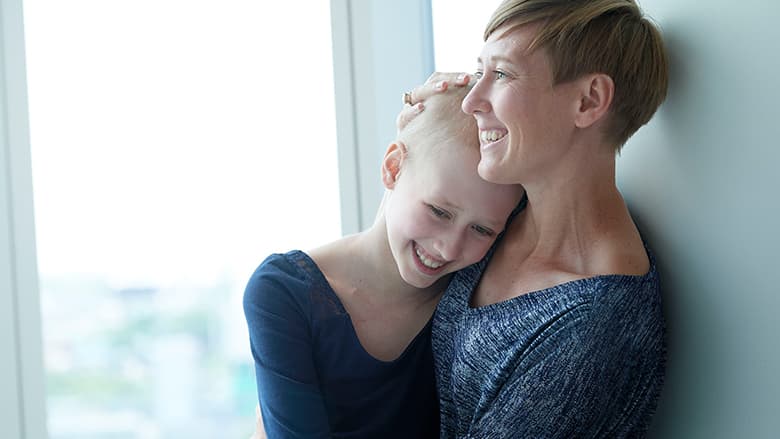 Lizzy smiling with her mom