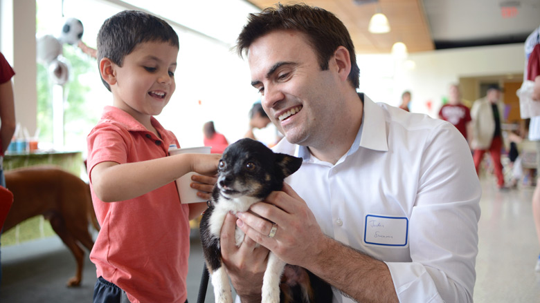Child with Volunteer and Puppy