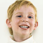Freckled boy smiled