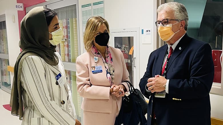 Three people talking with mask on