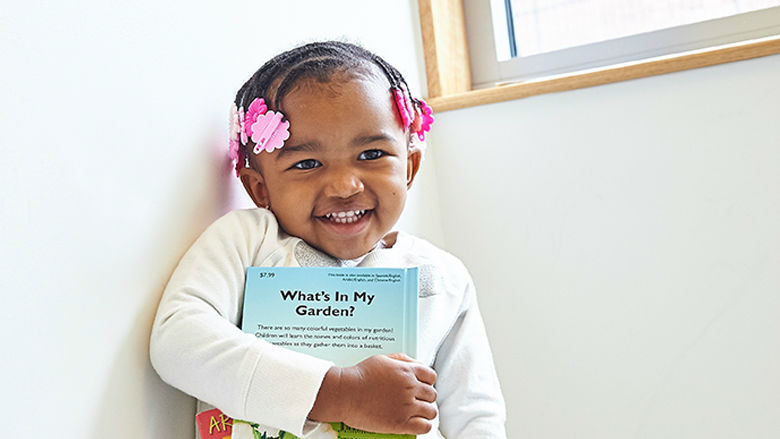 Young girl holding a book