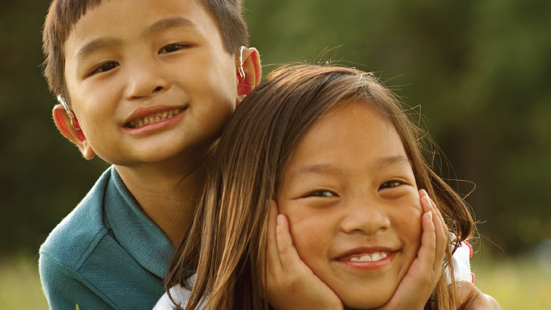 boy hugging girl and smiling