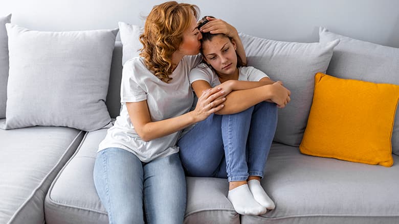 Mom consoling child