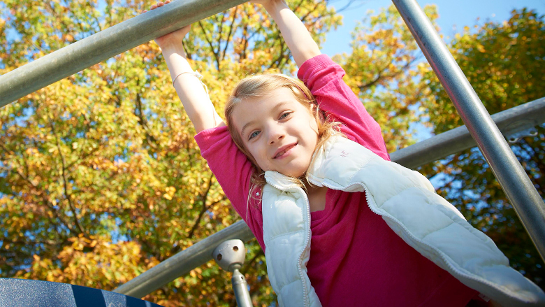 Girl on jungle gym