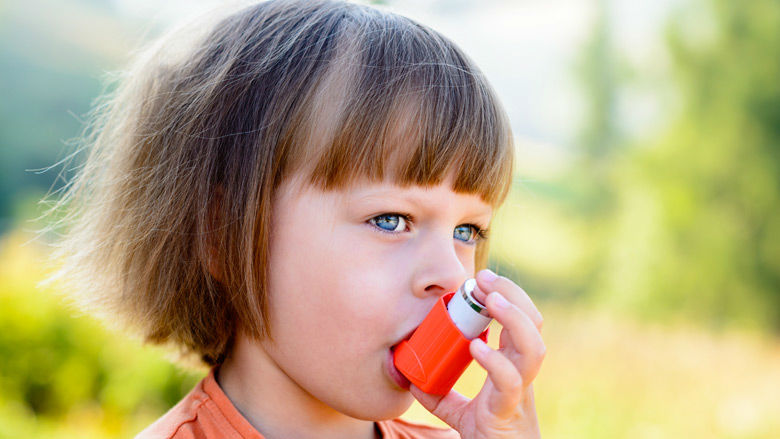 little girl with inhaler