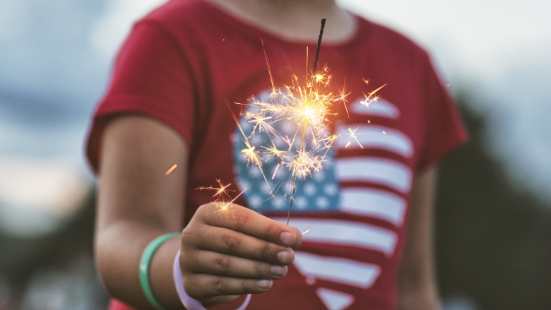 Child holding sparkler