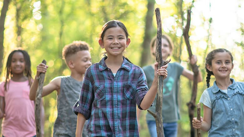 Group of kids walking in woods