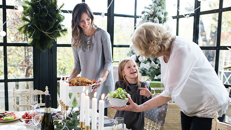 Grandmother, mother and child at holiday table