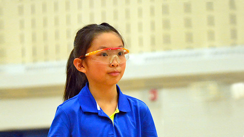Young girl wearing protective goggles