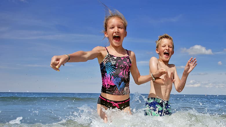 Kids playing in the ocean Kids playing in the ocean