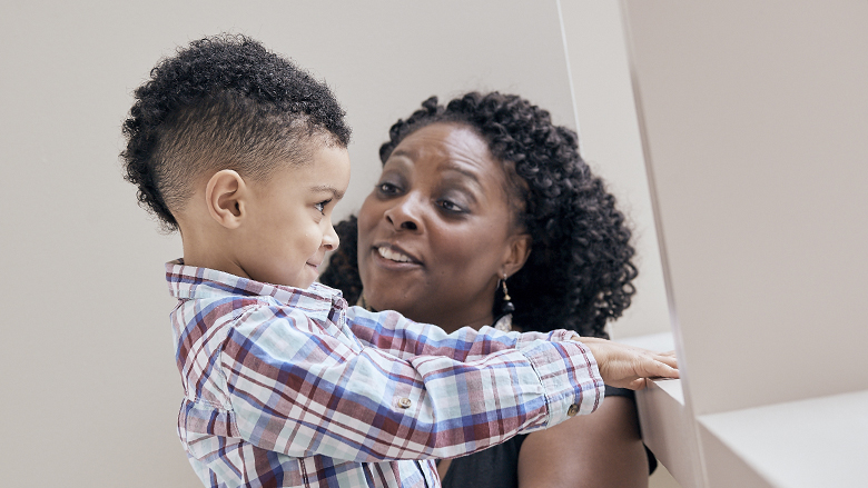 Mother talking to young son