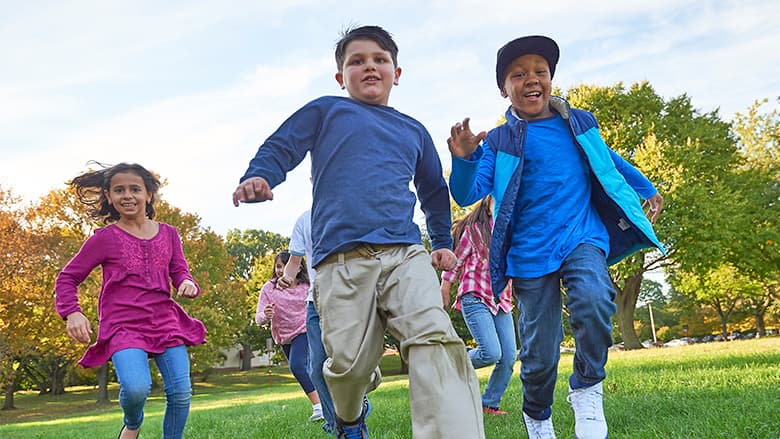 Group of kids running outside