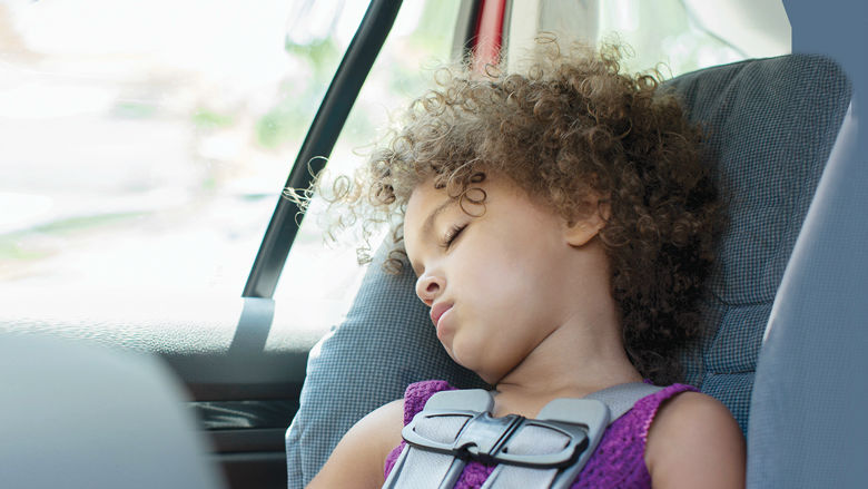 Young girl in car seat