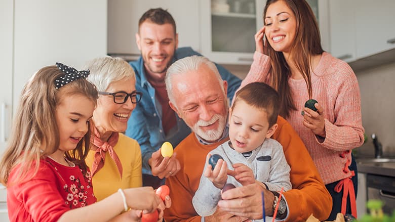 Children and grandparents holding Easter eggs Children and grandparents holding Easter eggs