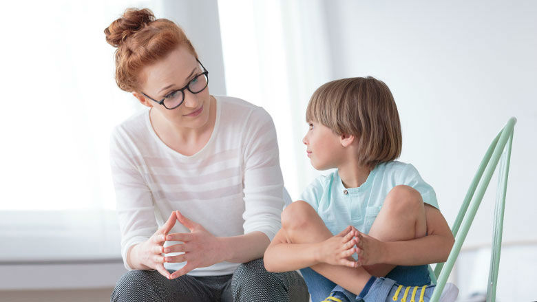 Mom talking to young son