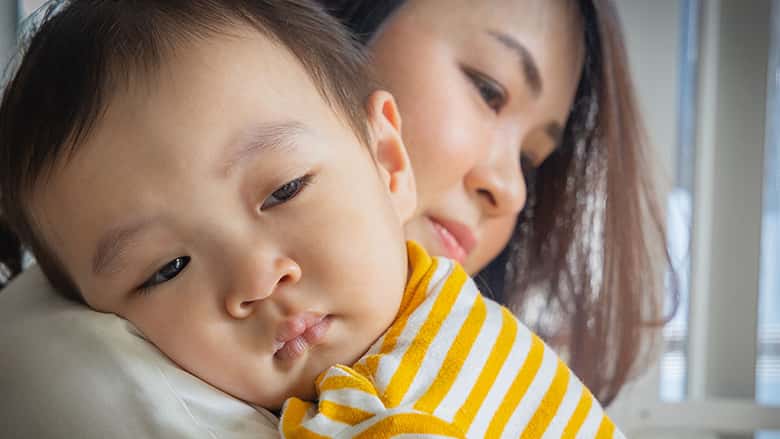 Mother comforting infant son