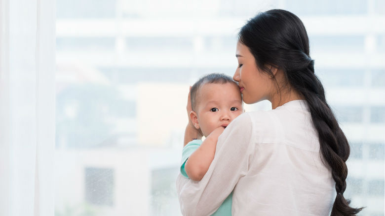 Mother holding young child