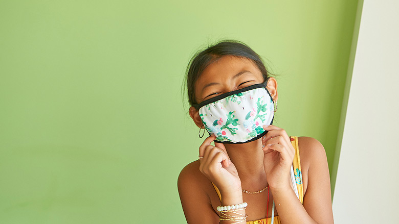 Young girl wearing a protective mask