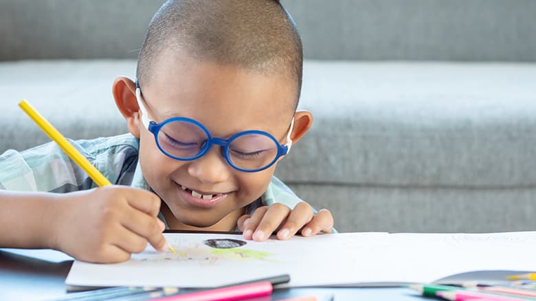 Young boy drawing a picture