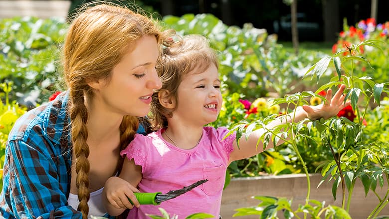 Mother and daughter in the garden