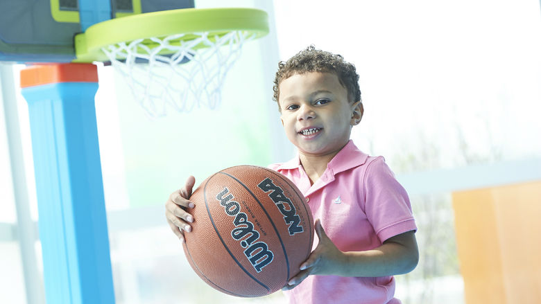Young boy holding a basketball