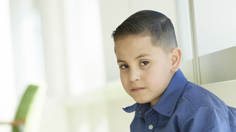 School-aged boy looking sad