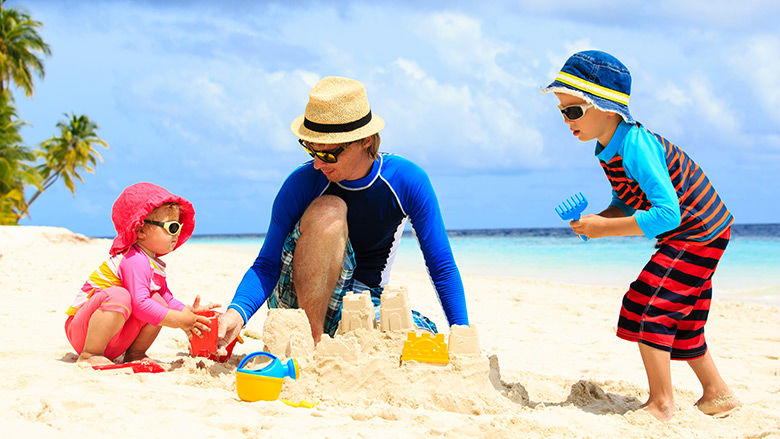 Family playing on the beach