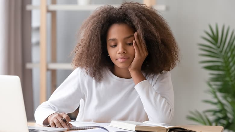 Teen girl reading book