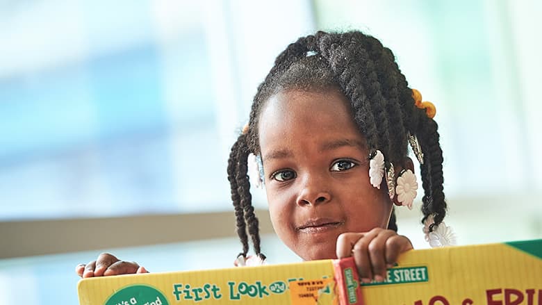 Young girl holding a book