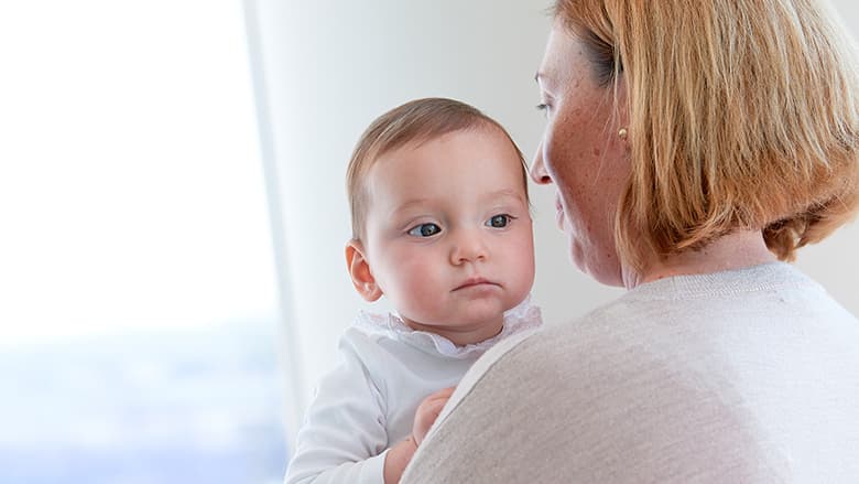 Mother holding young child