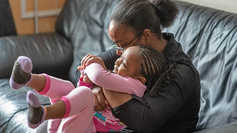 Mother and daughter on couch