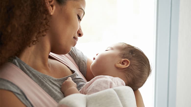 Mother holding healthy newborn