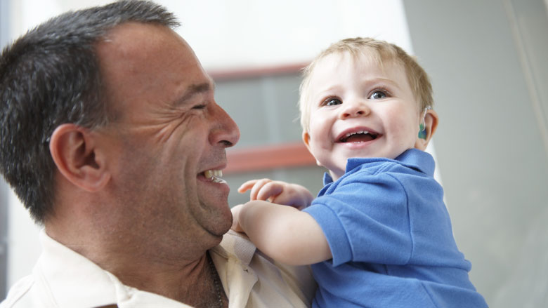 man holding baby