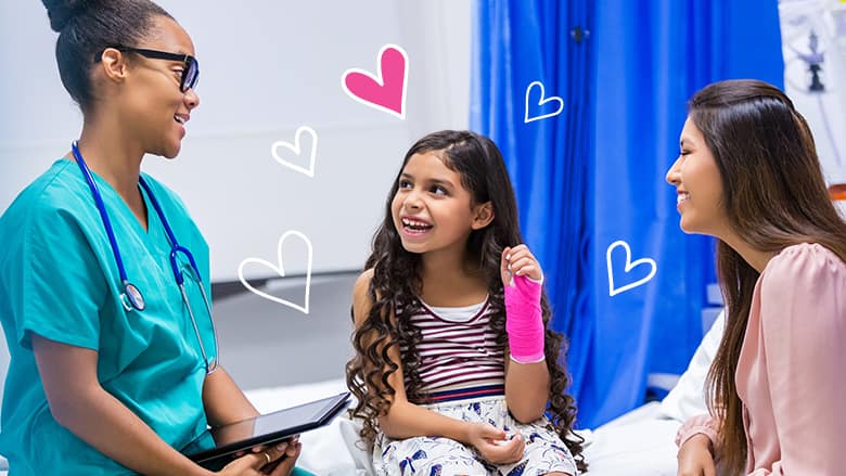 Girl in pink cast smiling with healthcare professional