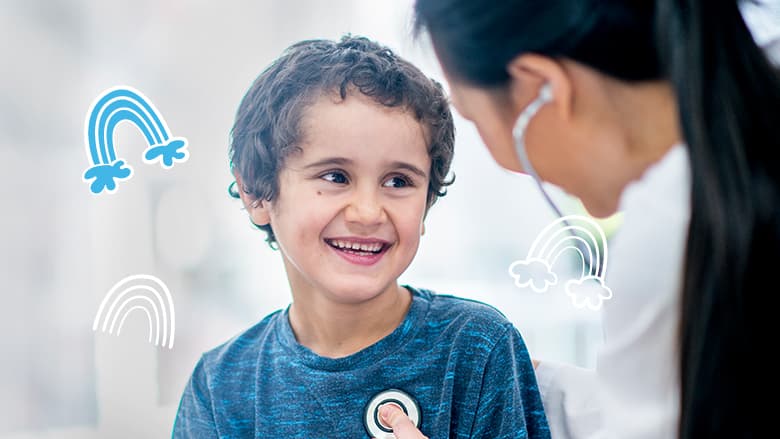 Child smiling with healthcare professional