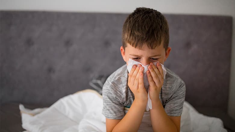 Child blowing their nose