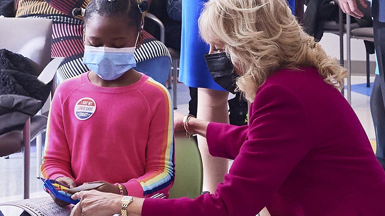 Jill Biden with a little girl at Karabots