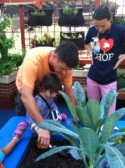 A CHOP patient at work in the Sea Garden at Children's Seashore House.