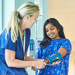 Nurse with patient wearing transparent IV sleeve