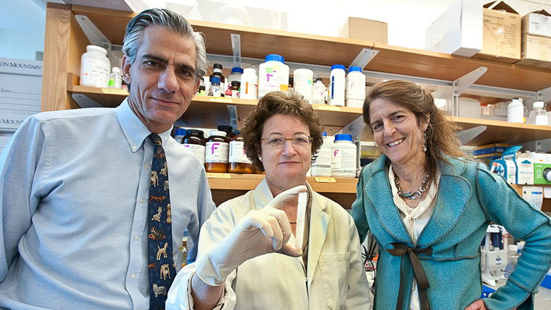 CHOP researchers holding test tube