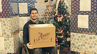 Frank Lamacchia holding a donation box