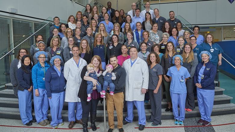 Twins, their parents, and the team at CHOP