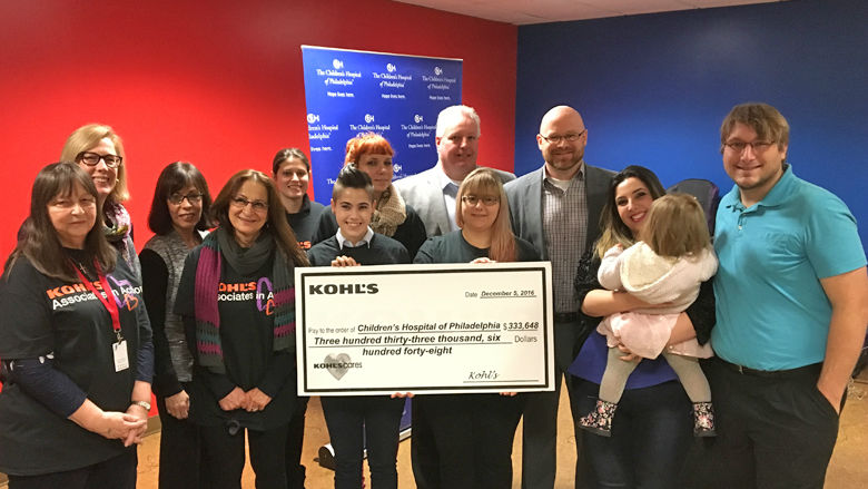 group standing with check